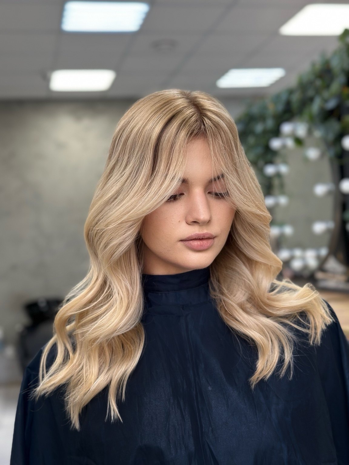 Soft blonde balayage waves by a Fulham hair colourist